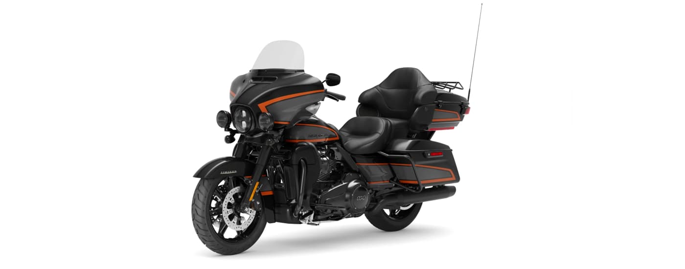 A black and orange 2022 Harley-Davidson Ultra Limited is angled left.