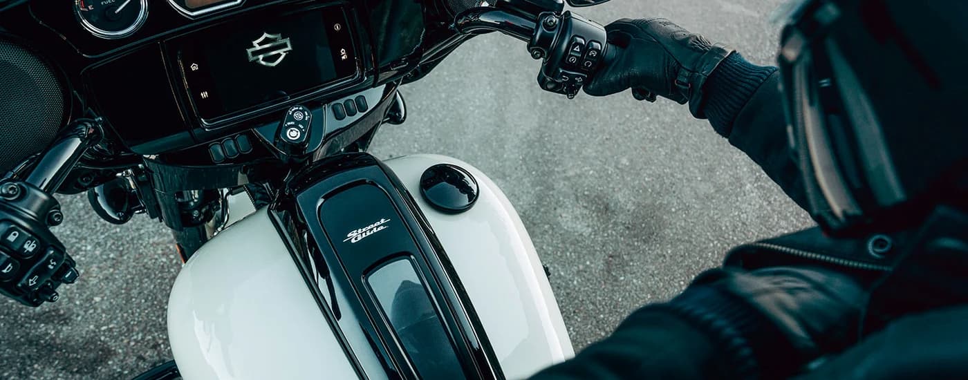 A close up of the Boom! Box GTS infotainment on a white 2023 Street Glide ST is shown.