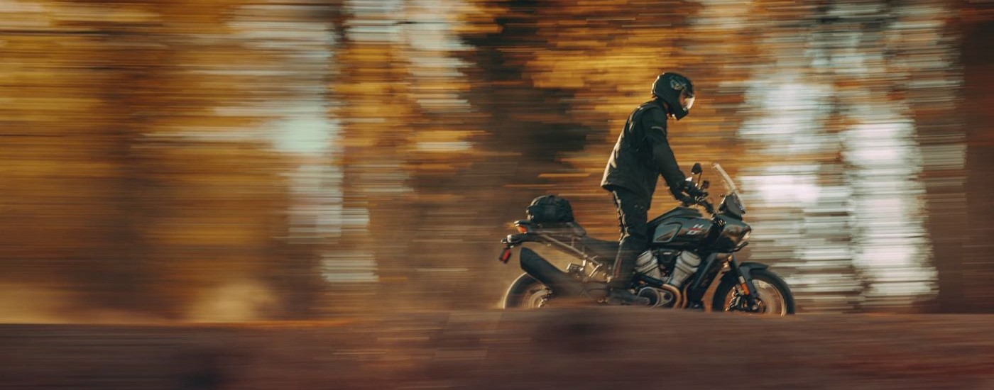 A person is shown riding a 2023 Harley-Davidson Pan Amercia 1250.